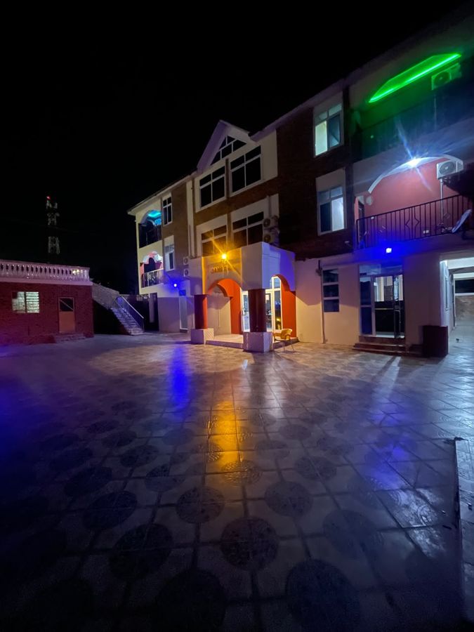 The main entrance lit up at night